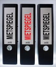 Three file folders labeled 'Mietspiegel'