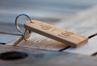 Room key lying on a wooden table