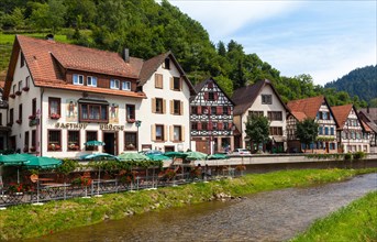 Half-timbered houses in Schiltach with the Schiltach River in the Kinzig Valley