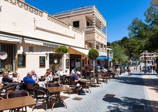 Outdoor restaurants with tourists in Sant Elm