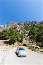 Car travelling on a mountain road near Estellencs