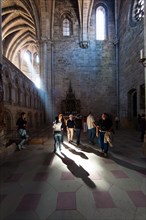 Tourists standing in the sunbeam