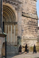Nuns standing in front of Bamberg Cathedral