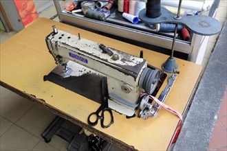 A Fomax sewing machine in a tailor shop