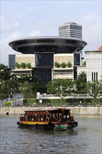 Excursion boat in front of the new Singapore Supreme Court building