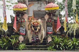 Barong dance in front of a Hindu temple with decorations in Batubulan