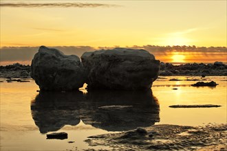 Sunset and stranded icebergs at low tide in Turnagain Arm