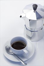 Italian style espresso maker with expresso cup