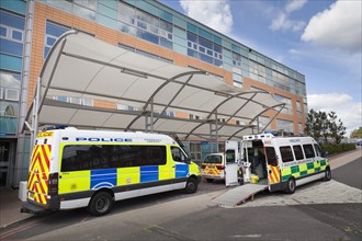 Police van and ambulance with open door at Southampton General Hospital