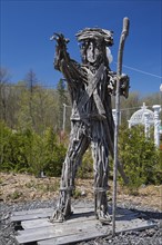 An unusual man like statue made of tree branches in the Fairy garden at the 'Route des Gerbes d'Angelica' garden in Mirabel