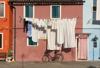 Street scene with laundry and bicycle