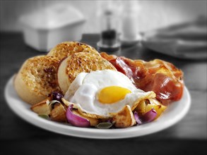 Traditional English fried breakfast with crumpets