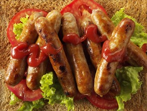 Traditional chipolatta pork sausages with tomato ketchup