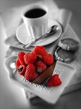 Individual chocolate cake with raspberries and coffee