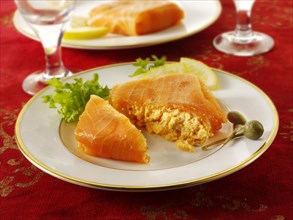 Smoked salmon parcel filled with cream cheese and cream cheese and crab
