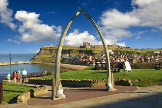 Whale Bone arch overlooking Whitby harbour with Whitby Abbey on the headland