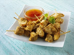 Traditional Oriental satay with chilli dipping sauce