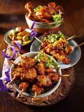 Oriental party buffet food with chicken satay