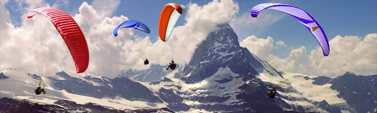 Paragliders over the Matterhorn mountain peak