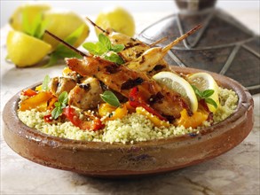 Couscous with Mediterranean roast vegetables and chicken kebabs