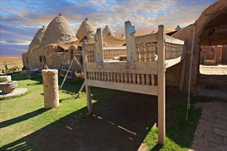 Beehive adobe buildings of Harran with a summer outdoor bed