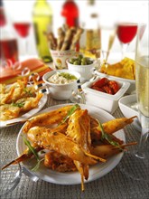 Party food with chicken satay and tapas