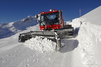 Snow groomer in winter in the mountains near Grindelwald First