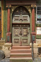 Renaissance door with painted wood carvings