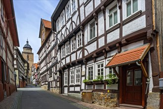Alleyway with half-timbered houses and tower of Walpurgis Church