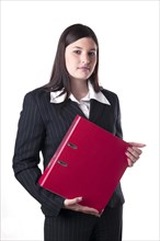 Businesswoman holding a red folder