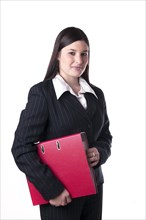 Businesswoman holding a red folder under her arm