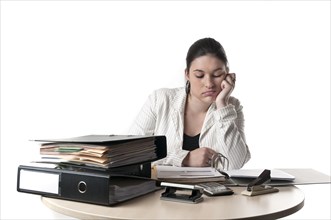 Office worker at a desk with files