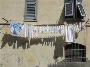 Laundry hanging on a clothesline on a facade