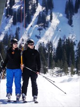 Two skiers on ski lift Fellhorn