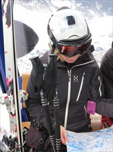 Skier studied card during a gondola ride in St. Anton am Arlberg