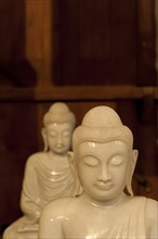 Two small Buddha statues