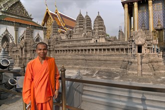 Monk in front of the model of Angkor Wat