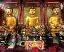 Three Buddha statues