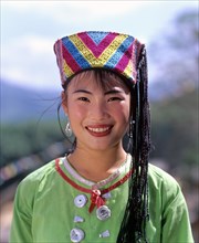 Miao girl wearing a traditional ethnic costume