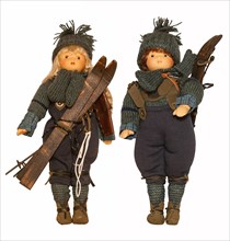 Dolls with historical ski clothing and skis