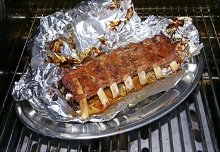 Marinated veal spareribs ready for barbecuing