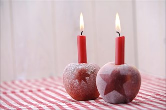 Christmas ambience with red apples and candles
