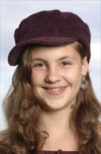 Teenage girl wearing a baseball cap