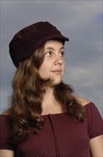 Teenage girl wearing a baseball cap