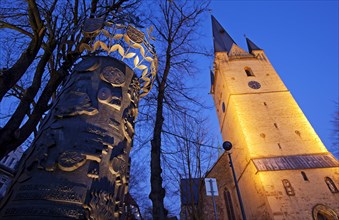 Illuminated Column of History with the illuminated St. Vincent Church