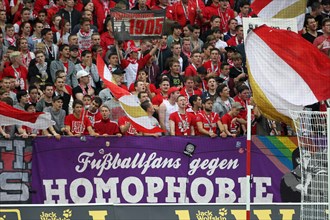 Fans of FSV Mainz 05 football club showing a banner 'Fussballfans gegen Homophobie'
