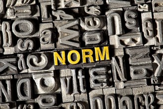 Old lead letters forming the word NORM