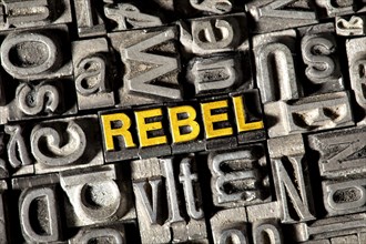 Old lead letters forming the word REBEL