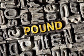 Old lead letters forming the word "POUND"