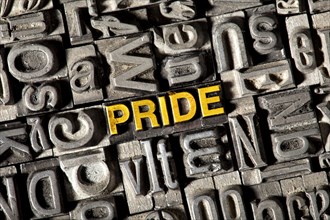 Old lead letters forming the word 'PRIDE'